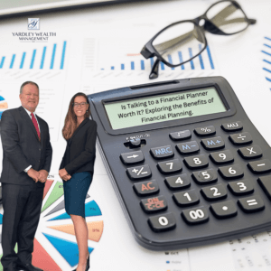 Is talking to a financial planner worth it? Image shows two financial professionals from Yardley Wealth Management standing in front of financial charts, alongside a calculator displaying the blog title about financial planning benefits. Business graphs, reading glasses, and the Yardley Wealth Management logo complete the professional financial planning scene.